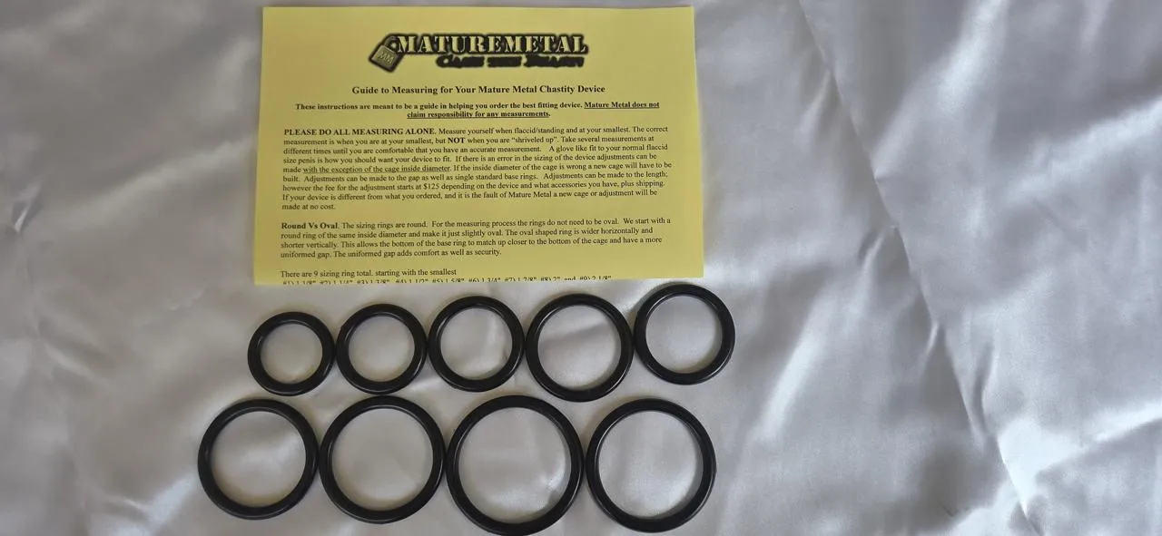 Mature Metal plastic sizing ring kit: nine black rings from 1 1/8 inch to 2 1/8 inch beside the printed measuring instruction sheet.