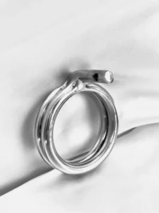 A double base ring for a chastity cage, two stacked stainless steel rings