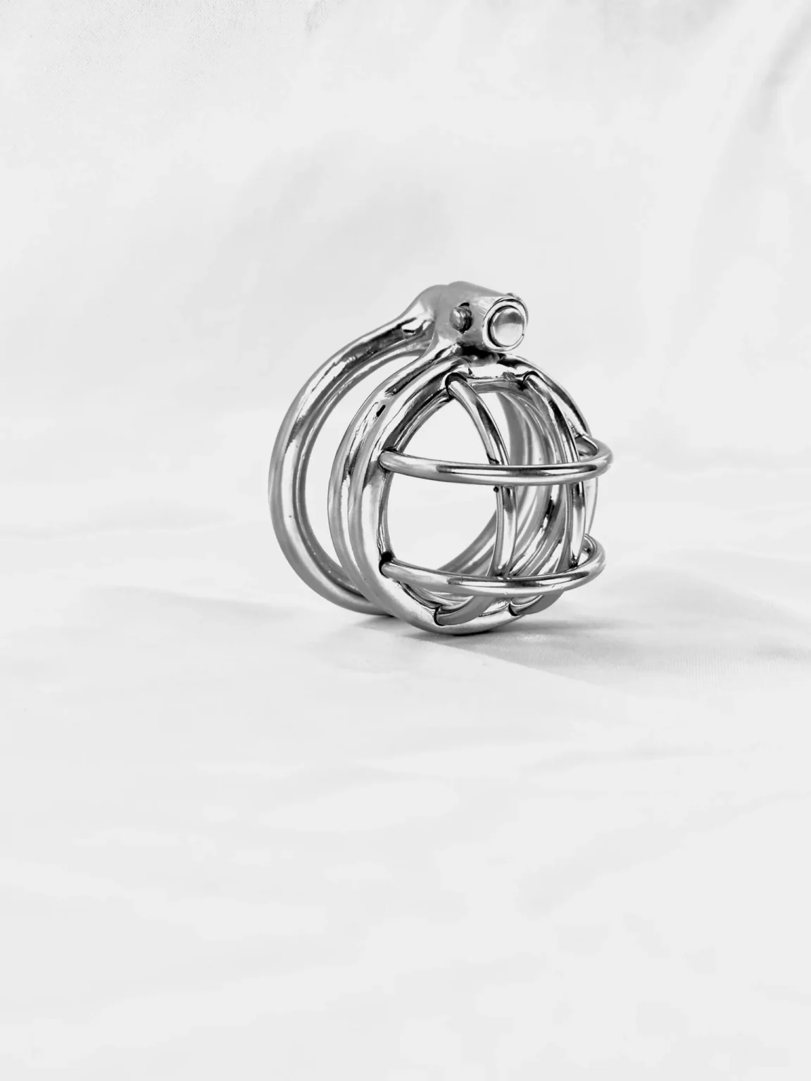 Mini Jailbird, a short stainless steel chastity cage