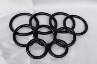 The nine plastic sizing rings used to find cage and base ring diameters